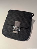 Front view showing FF monogram, leather tab, buckle
