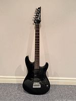 Full view of Ibanez RG120 guitar standing upright