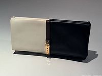 Front view showing two-tone leather, brown strap, gold hardware