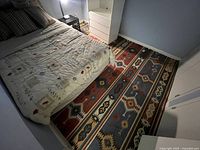 Rug shown under bed to illustrate overall size and colour