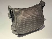 Front view of grey crocodile leather bag