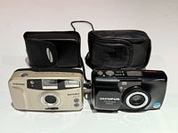 Front view of both cameras with pouches behind