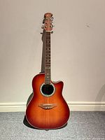 Full view of Ovation sunburst acoustic-electric guitar