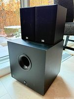 PSB speakers stacked on JBL subwoofer full view