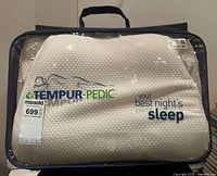 Front of sealed Tempur-Pedic neck pillow package showing branding
