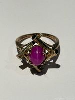 Ring front view showing ruby and lattice setting