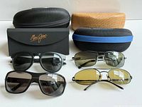 Group shot of three sunglasses and four cases
