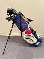 Full side view of Sun Mountain stand bag with clubs