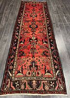 Full view of the entire Hamadan runner rug on dark floor