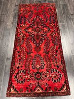 Full view of rug on floor showing entire pattern and size