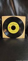 Front view of 7-inch Rolling Stones single in tan sleeve