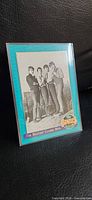Front of Beatles Classic Hits card in sleeve showing photo and border