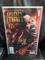 Front view of Ultimate Iron Man #1 comic in protective sleeve
