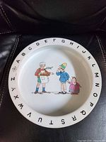 Top view showing alphabet rim and children illustration