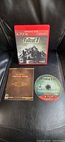 Front view of Fallout 3 PS3 case, disc and manual