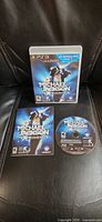Front view of PS3 game case, manual and disc