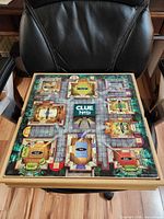 Clue playing surface on wooden board