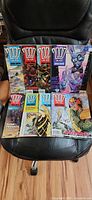 Group shot of all eight 2000 AD comics laid out on chair