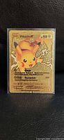 Front view of metallic gold Pikachu V fan art card in sleeve