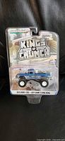 Front view of sealed GreenLight Kings of Crunch monster truck package