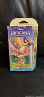 Front view of sealed Disney Lorcana Into the Inklands starter deck box