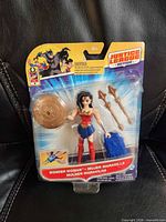 Front view of sealed Wonder Woman figure, accessories and card art visible