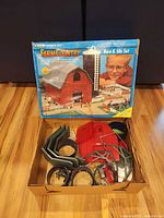 Box lid showing Ertl Farm Country branding and wear