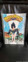 Full view of Wonder Woman #3 comic in bag on black leather background