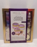 Front of sealed Creative You Custom Candles kit box showing contents list and images of finished candles