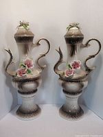 Front view of both matching lidded vases