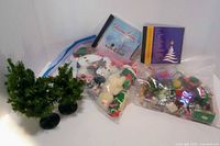 All items: two bags ornaments, three tabletop trees, two Christmas CDs