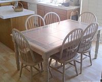 Table and six chairs assembled in kitchen