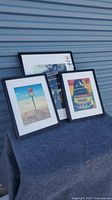 All three framed prints grouped on table