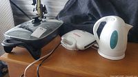 All three appliances side by side: skillet, sandwich maker, kettle