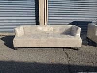 Front view of wrapped light beige 3-seat sofa