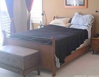 Bed assembled with bedding to show overall appearance