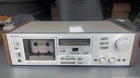 Front view of Sony TC-K65 deck showing cassette bay, controls and meters