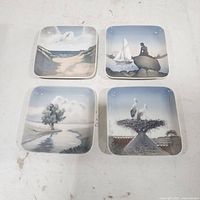 Front view of the four square plates showing motifs