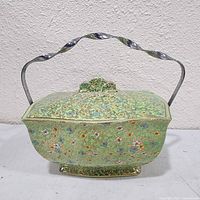Front view of cloisonné tureen showing enamel decoration and handle