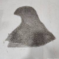 Chainmail coif laid flat showing full form