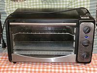 Front view of Paderno toaster oven showing controls, glass door and exterior condition