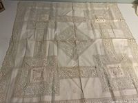 large square lace table topper laid flat