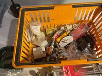 Basket with assorted small hardware parts