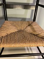 Close-up of woven rush seat showing material and pattern