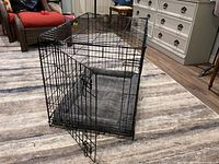 crate angled view open door showing gray pad