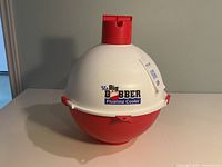 Closed bobber-shaped cooler showing brand logo and top handle