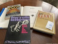 All four books displayed, Jazz open to title page