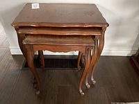 Front view of all three nested tables showing style and legs