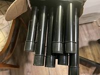view of several black balusters inside box