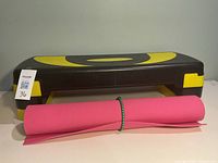 aerobic step platform with yoga mat in front